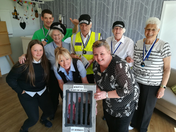 Left to right: volunteer/intern Leah Malone; domestic assistant Stevie Allan; resident Barbara Clubb; activities coordinator Paula Balfour; resident Bert Middlemiss; home manager Denise McCorkindale; resident Jean Reid; volunteer Ella Gibson.